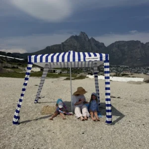 Family under a Navy & White cabana with Lion's Head behind